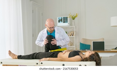 The Physical Therapist Evaluates the Condition and Suggests Appropriate Treatment to Relieve the Patient's Pain. Physiotherapy Treatment in the Modern Rehabilitation Clinic - Shutterstock ID 2167530053