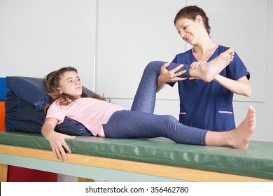 Physical Therapist  Giving  A  Leg Massage