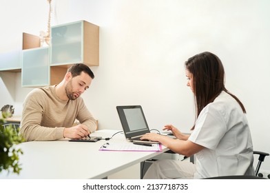 The Physical Therapist And The Patient Fill Out A Patient Form.