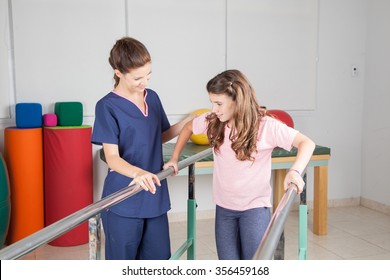  Physical therapist with patient in rehabilitation