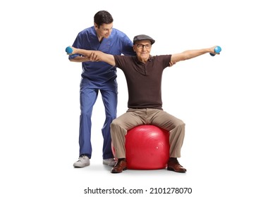 Physical therapist working with an elderly man doing exercise on a fitness ball isolated on white background - Powered by Shutterstock