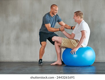 Physical therapy, amputee and exercise ball with a man with a disability and physio for rehabilitation. Physiotherapy, help and healthcare professional with trainer helping and wellness for mobility - Powered by Shutterstock