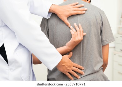 Physical therapy, Asian therapist doctor treat perform pain young man in hospital. - Powered by Shutterstock