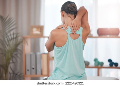 Physical therapy, chiropractor and back pain of a woman patient ready for physiotherapy and wellness. Spa, chiropractor consultation and person with a spine problem stretching for chiropractic health
