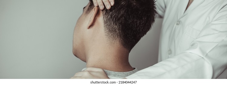 Physical therapy, Female physiotherapist examined the neck injuries of a male patient attending the clinic, Bone arrangement, Non-surgical medical treatment, Modern medical techniques. - Powered by Shutterstock