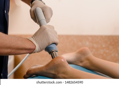 Physical Therapy Of Foot With Acoustic Shock Waves, Closeup Photo