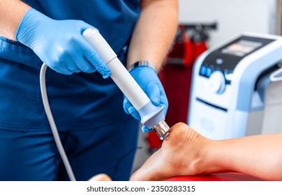 Physical therapy of foot with acoustic shock waves, close up. - Powered by Shutterstock