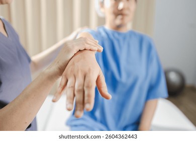 A Physical therapy, Physical therapy involves hands on techniques to improve mobility and function. therapist assists patient in clinical setting, focusing on rehabilitation
