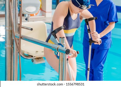 Physical Therapy Swimming Pool Rehabilitation. Caucasian Disabled Girl. Healthcare Industry Theme.