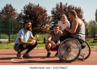 A physically challenged basketball coach plays streetball with his students.They are talking about tactics.	
 - Powered by Shutterstock