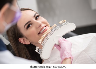 Physician Enclosing Dental Crown To Happy Lady