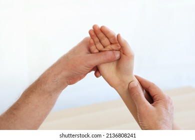 The Physician Give Diagnosis And Treatment To A Child With Wrist Sprains Or Wrist Pain In Children, Isolated On White. 