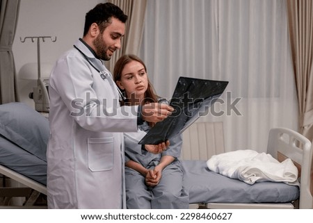 Similar – Grateful senior female patient giving gift to female doctor