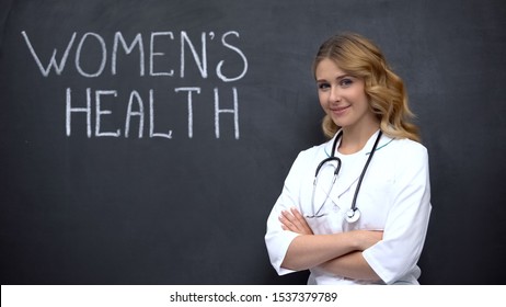 Physician Standing Near Womens Health Inscription, Annual Physical Examination