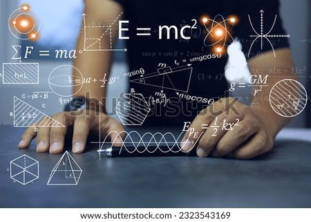 Physics equations floating in the background on tables, representing the learning teaching or scientific notes of Albert Einstein and Sir Isaac Newton physics and math concept