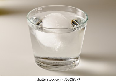 Physics. Ice Cube Floating In A Glass Of Water. Archimedes Principle.