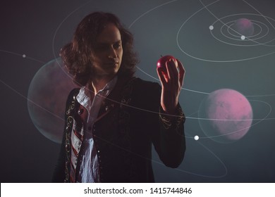 Physics The Science Of Nature, The Concept Of Studying The Laws Of Nature. A Young Man In The Image Of Isaac Newton. With An Apple In Hand, The Concept Of The Laws Of Gravity.