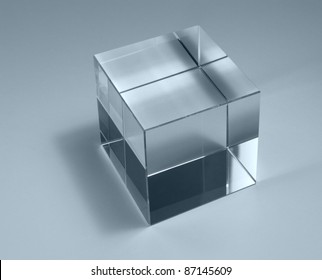 Physics Theme With Studio Photography Of A Solid Glass Cube In Light Back, Blue Toned