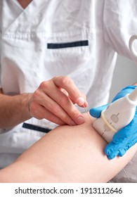 Physio Therapist Treating A Patient With Percutaneous Electrolysis, No Faces Shown