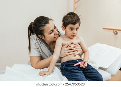 Physiotherapist assisting young boy with respiratory physiotherapy - Powered by Shutterstock