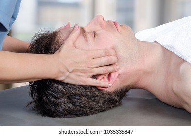 Physiotherapist, Chiropractor Assessing The Muscles On A Jaw. Osteopathy