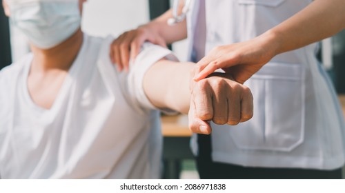 Physiotherapist Doing Healing Treatment On Man's Arm. Arm Pain Patient, Treatment, Medical Doctor, Massage Therapist.office Syndrome