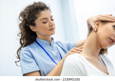 Physiotherapist doing healing treatment on womans neck,Chiropractic adjustment, pain relief concept.office syndrome - Powered by Shutterstock