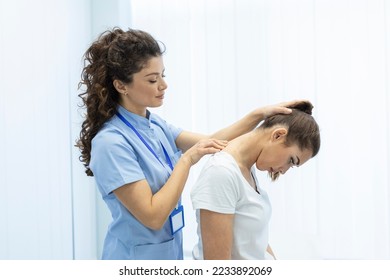 Physiotherapist doing healing treatment on womans neck,Chiropractic adjustment, pain relief concept.office syndrome