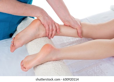 Physiotherapist Doing Leg Massage In Medical Office