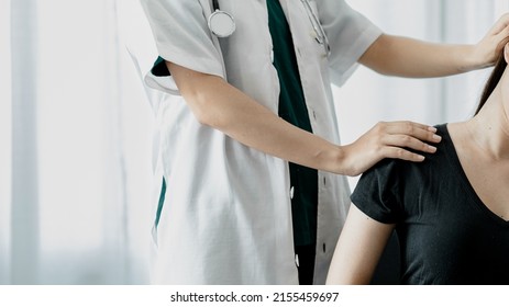 Physiotherapist is doing physical therapy for a patient, the patient has body aches due to overwork and has undergone treatment and physiotherapy with a professional physiotherapist. - Shutterstock ID 2155459697