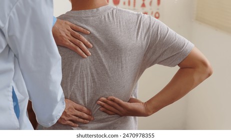 Physiotherapist doing physiotherapy for patient in a hospital room, physiotherapy helps to recover from illness by moving the body and muscles. The concept of treating illnesses with physical therapy. - Powered by Shutterstock