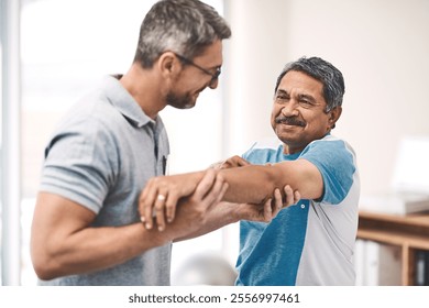 Physiotherapist, elderly man and stretching for health, exercise or sport in wellness, help and gym. Male people, arm and body care as physiotherapy, fitness or rehabilitation clinic for consultation - Powered by Shutterstock