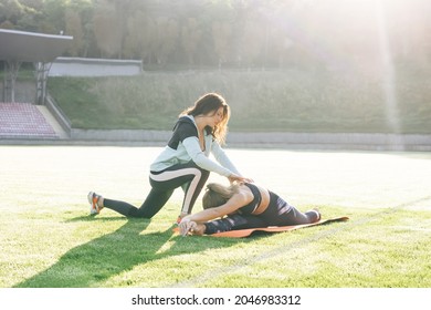 Physiotherapist expert checking of sportswoman physical treatment for rehabilitation. The doctor works on specific muscle groups or joints. Physiotherapy and recovery. Rehabilitation concept - Shutterstock ID 2046983312