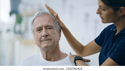 Physiotherapist, healing and healthcare for elderly man, head pain and massage for senior care and clinic. Retirement, chiropractic and woman with client, sore and help for headache and service - Powered by Shutterstock