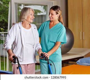 Physiotherapist helping senior woman with walker at remedial gymnastics - Powered by Shutterstock