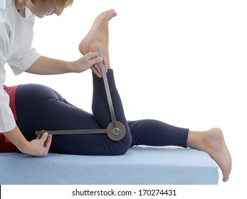 Physiotherapist Measuring Active Range Of Motion Of Older Patient's Lower Limb Using Manual Goniometer