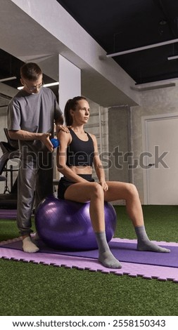 Similar – Image, Stock Photo A female physiotherapist performs stretches on the neck of her patient, an elderly man, to aid in his rehabilitation and wellbeing