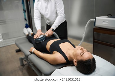 Physiotherapist treatment of hip pain and nerves for lady - Powered by Shutterstock