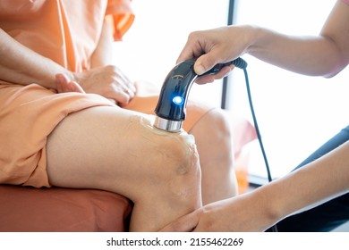 Physiotherapist treatment of knee injuries and nerves Method of treatment with ultrasound machine and gel therapy health and medicine concept. Physiotherapy technique.