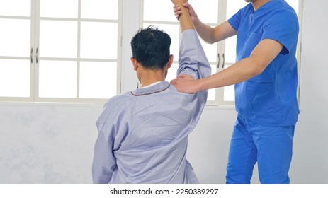 A physiotherapist who performs rehabilitation. Massage. - Powered by Shutterstock