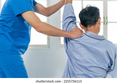 A physiotherapist who performs rehabilitation. Massage. - Powered by Shutterstock