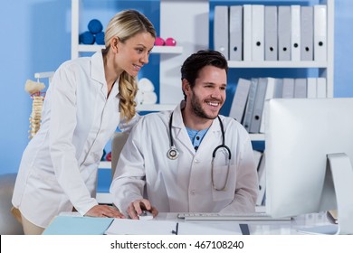 Physiotherapist Working On Computer In Clinic