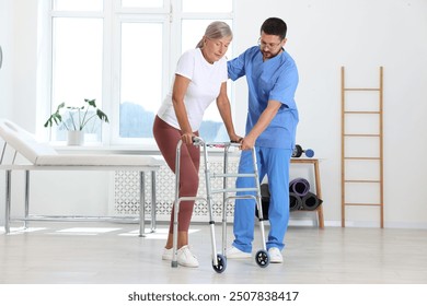 Physiotherapist working with senior patient in rehabilitation center - Powered by Shutterstock