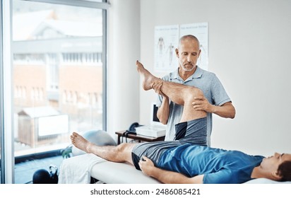 Physiotherapy, men and client with recovery, leg pain and healing with wellness, service and expert with skill. People, physical therapist or customer with injury, health and trust with consultation - Powered by Shutterstock