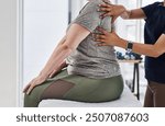 Physiotherapy, people and hands on back for massage, healing and pressure on shoulder blade. Chiropractor, patient and assessment on bed for wellness, injury and help for recovery or rehabilitation