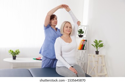 Physiotherapy, sport injury rehabilitation treatment. Woman having chiropractic back adjustment. Osteopathy, Alternative medicine, pain relief concept. Closeup - Powered by Shutterstock