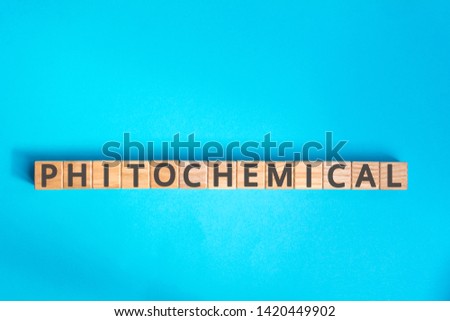 Phytochemical inscription wooden cubes with letters on a blue background