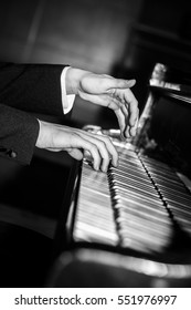 Pianist hands playing black and white