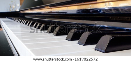 Piano banner background. Closeup of piano keys. black and white keyboard background. close piano key side view. Image can be represent as classical instrumental music.