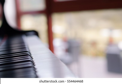 Piano with blur window background.Selective focus.